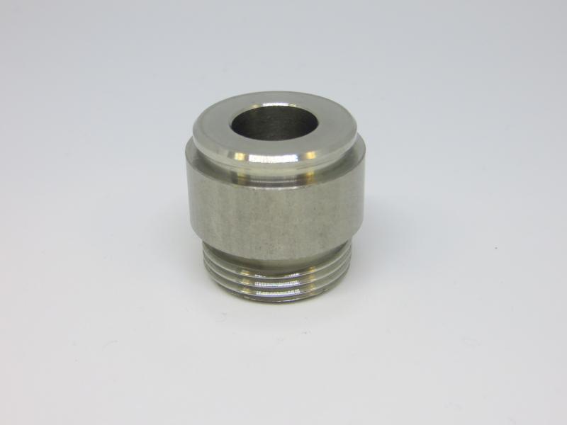 Peça INOX com furo central.